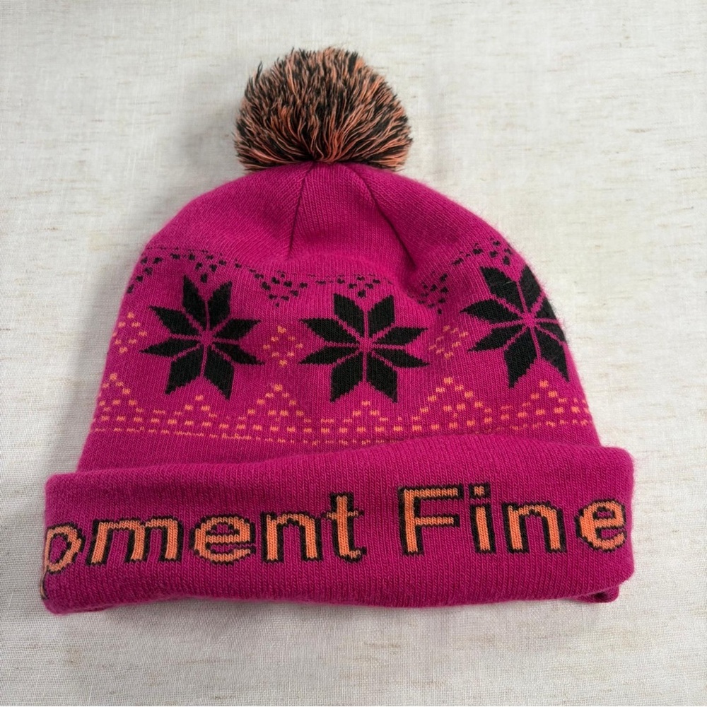 The North Face Pink Pom Pom Knit Beanie with Snowflake Pattern
